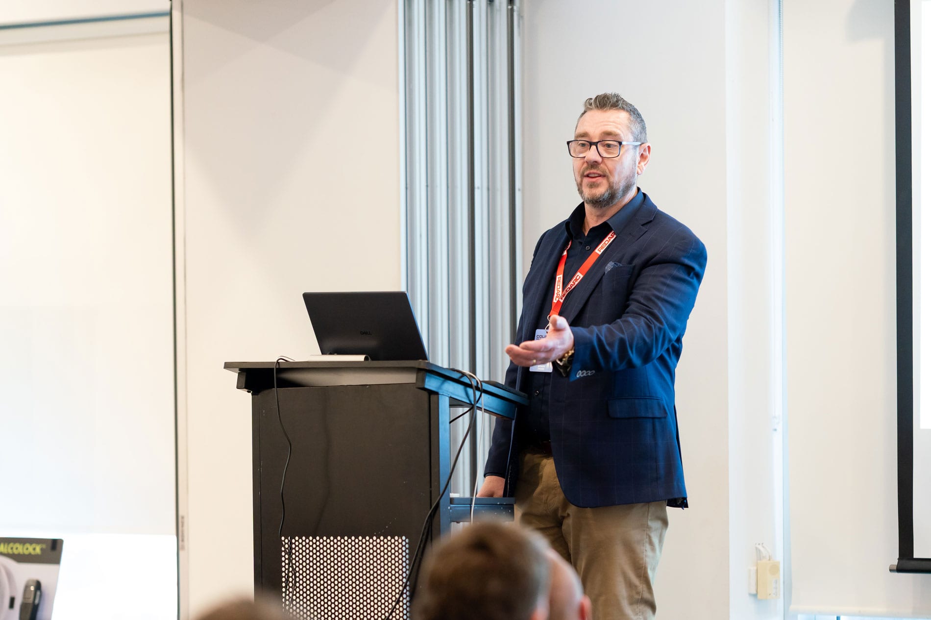 Colin Wilson delivering a keynote from the lectern